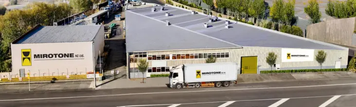 Mirotone Factory building in newzeland,a white color truck parked infront of the building