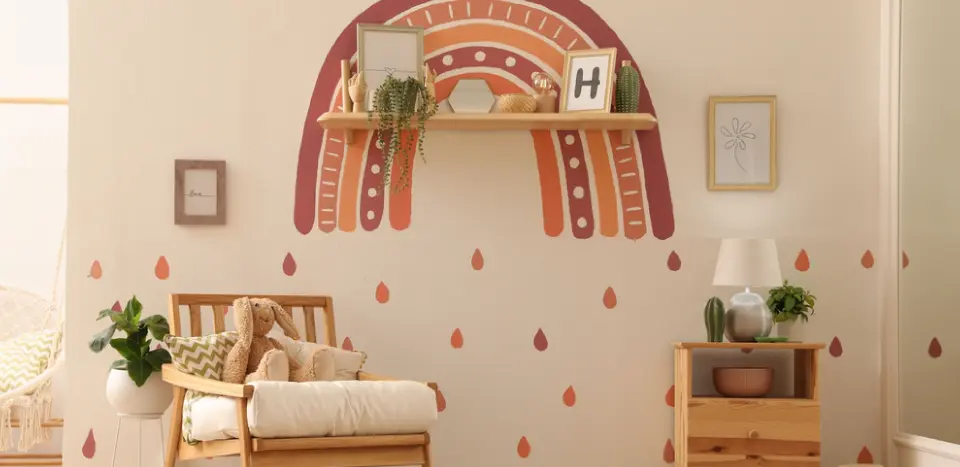 A wall of a living room with a rainbow sticker in the wall